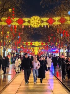 Tourists enjoying the lanterns on Qianmen Street
