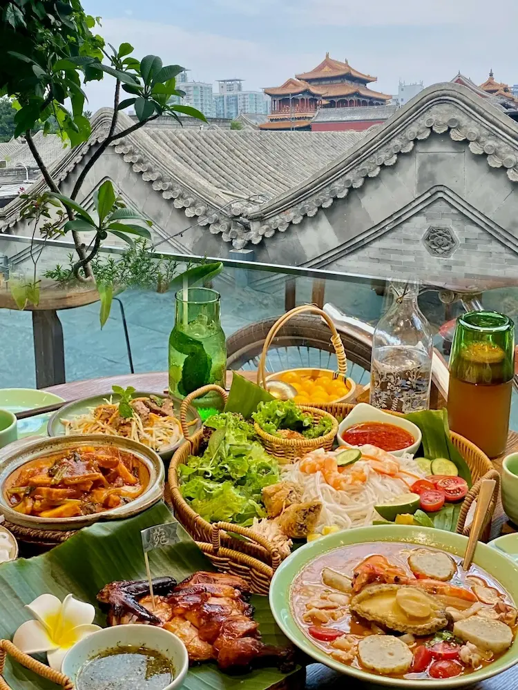 From the terrace restaurant, you can see the grey walls and tiled roofs of the hutong courtyard houses.
