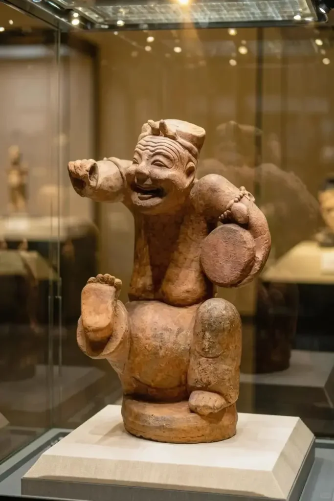 Drum-Beating and Storytelling Figurine