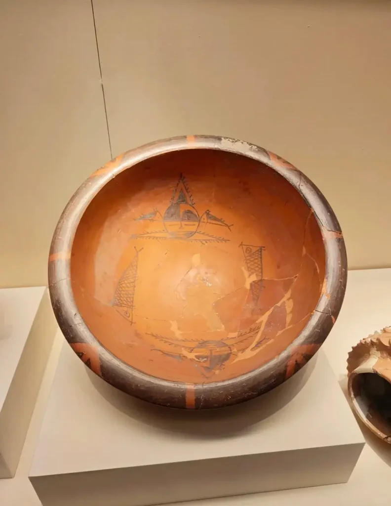 Polychrome Pottery Basin with Human Faces and Fish Patterns